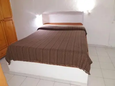 Cama o camas de una habitación en Casa cueva primera línea playa