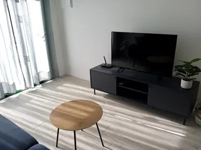 Una televisión o centro de entretenimiento en Apartamento Deluxe en Canaima- Puerto Rico