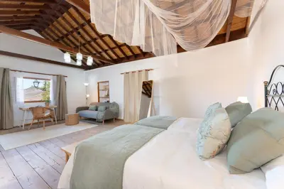 Cama o camas de una habitación en Vivelorural Casa Pepe vistas a la montaña, Tejeda
