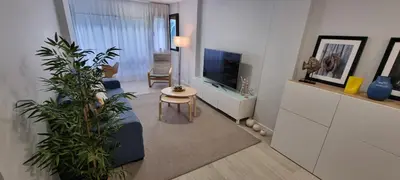 Una televisión o centro de entretenimiento en Salinetas apartamento junto al mar