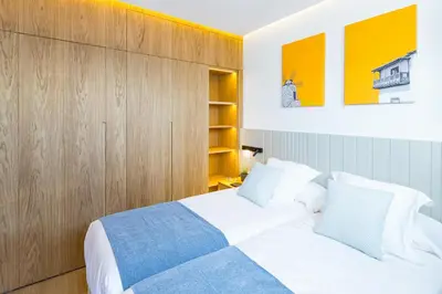 Cama o camas de una habitación en Los Canarios 527 by VillaGranCanaria