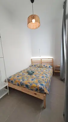 Cama o camas de una habitación en The Wave Temple II Apartment