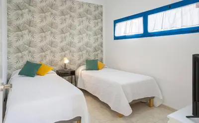 Cama o camas de una habitación en African Sunrise by Villas Rivero