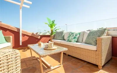 Zona de estar de Chalé con terraza en la costa