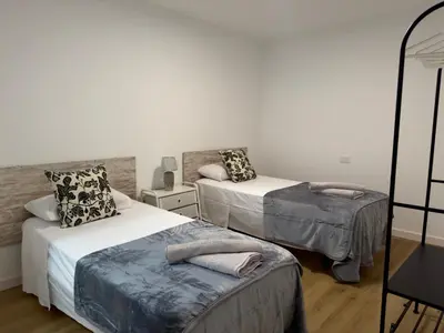 Cama o camas de una habitación en La Perla de Las Canteras
