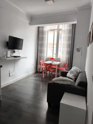 Una televisión o centro de entretenimiento en JOCA House I Las Canteras