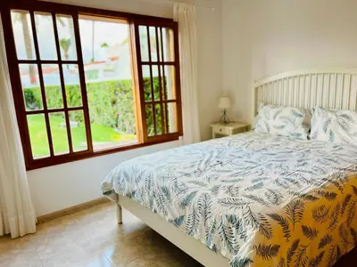 Cama o camas de una habitación en Arena y mar