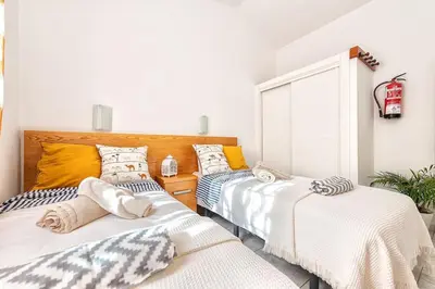 Cama o camas de una habitación en Bungalow Arcos 78