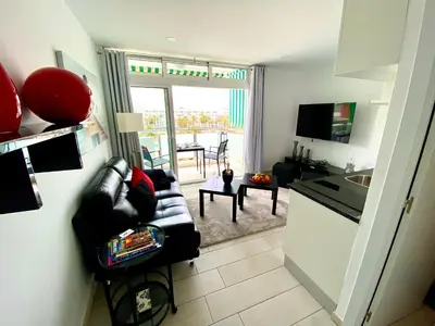 Una televisión o centro de entretenimiento en Solymar Luxus Apartment