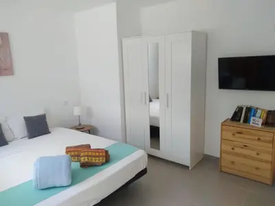Cama o camas de una habitación en Yumbo Rainbow Homes D