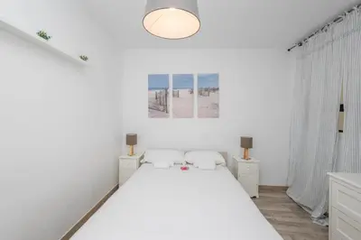 Cama o camas de una habitación en The Sweet Home - 3BR & 4 min Las Canteras