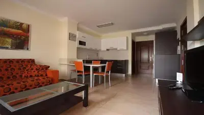 Una televisión o centro de entretenimiento en Playa Las Canteras Brisa y Sol