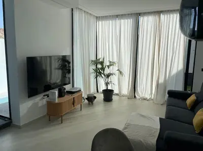 Una televisión o centro de entretenimiento en Luxury Villa in Melenara