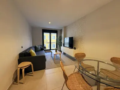 Una televisión o centro de entretenimiento en Las Canteras Deluxe