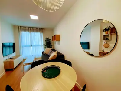 Una televisión o centro de entretenimiento en Las Canteras Deluxe