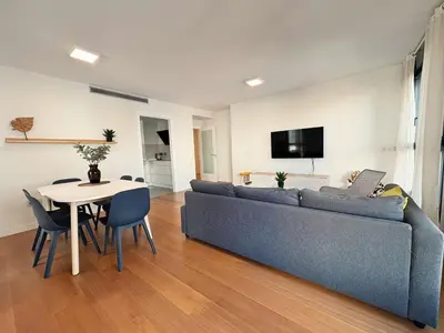 Una televisión o centro de entretenimiento en Las Canteras Deluxe