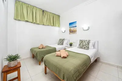 Cama o camas de una habitación en Beach View Apartment I