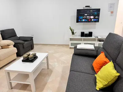 Una televisión o centro de entretenimiento en Apartamento Cerca de Maspalomas