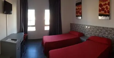 Una televisión o centro de entretenimiento en Hotel Playa de Arinaga