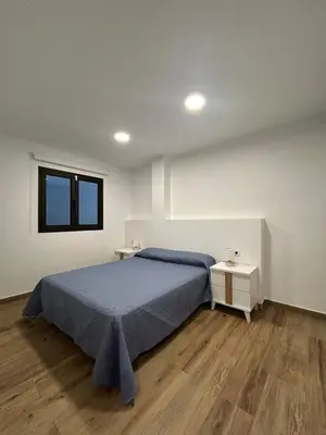 Cama o camas de una habitación en El Faro Suite Arinaga