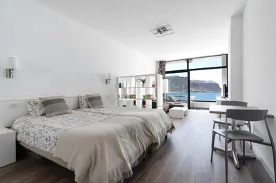 Cama o camas de una habitación en Home2Book Gorgeous Oceanfront Studio Mogán, Views