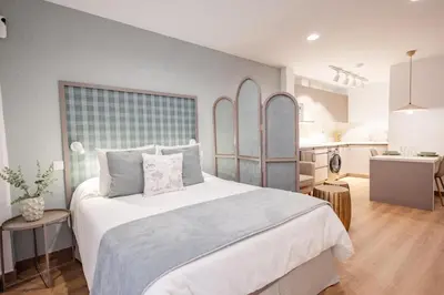 Cama o camas de una habitación en Alcaravaneras Beach Loft