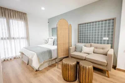 Cama o camas de una habitación en Alcaravaneras Beach Loft