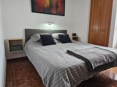 Cama o camas de una habitación en Barbados Tirajana Two Bedroom Apartment