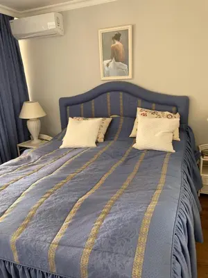 Cama o camas de una habitación en Flott leilighet på Montemarina