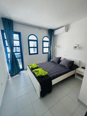 Cama o camas de una habitación en Bungalow Gilly
