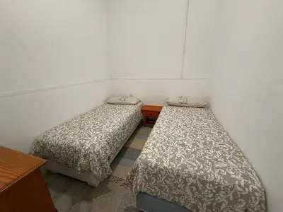 Cama o camas de una habitación en Town House Near The Beach