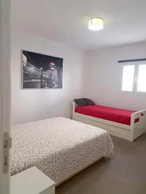 Cama o camas de una habitación en Beach House Arinaga
