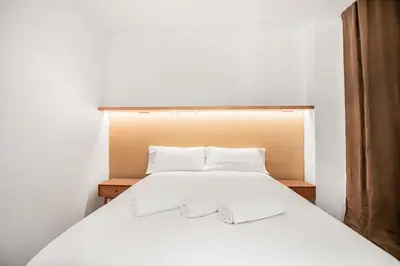 Cama o camas de una habitación en Las Palmas Beach House Retreat
