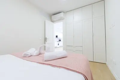 Cama o camas de una habitación en M&M SUITE LOS CACTUS by HOMESTAYGRANCANARIA