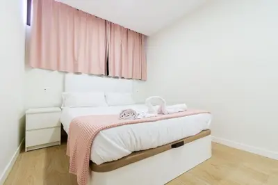Cama o camas de una habitación en M&M SUITE LOS CACTUS by HOMESTAYGRANCANARIA