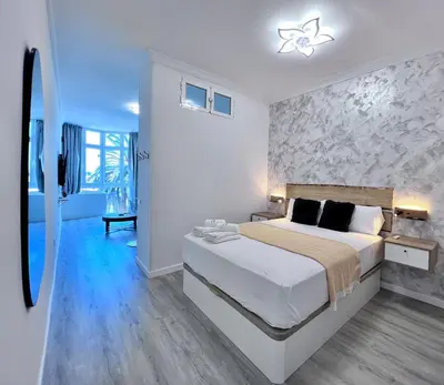 Cama o camas de una habitación en Apartamento Bahía con AIRE ACONDICIONADO