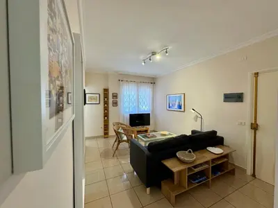 Una televisión o centro de entretenimiento en Mesa y Lopez Home
