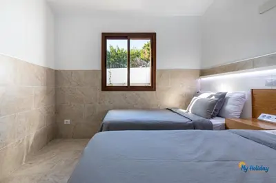 Cama o camas de una habitación en Villa Sun Paradiso