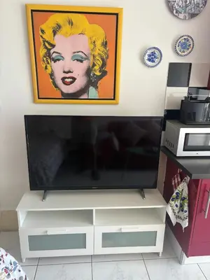 Una televisión o centro de entretenimiento en Nice Studio Apartment with Ocean View
