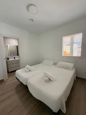 Cama o camas de una habitación en Lovisi Suite Playa del Cura - OCEAN & POOL VIEW