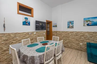 Una televisión o centro de entretenimiento en Casa Playa Melenara