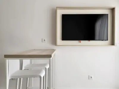 Una televisión o centro de entretenimiento en Salt Apartments Tivoli