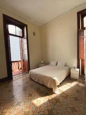 Cama o camas de una habitación en Comfortable Room in Historic Casa Quesada Shared House