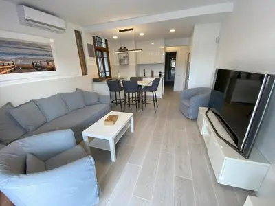 Zona de estar de Refurbished apartment next to the beach