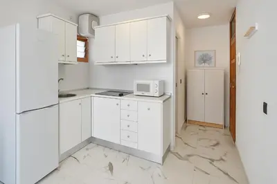 Una cocina o zona de cocina en Guayarmina 201