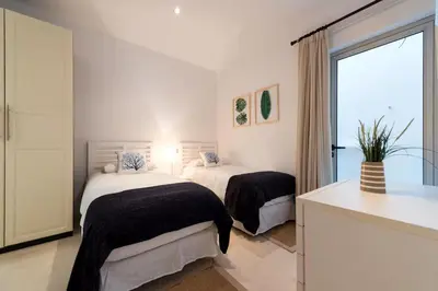 Cama o camas de una habitación en Sunset Paradise