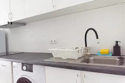 Una cocina o zona de cocina en Piso con Piscina comunitaria