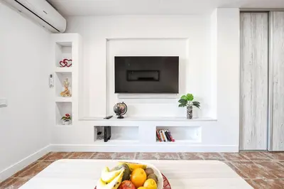 Una televisión o centro de entretenimiento en Twilight Dreams - Design apartment pool beach Playa del Ingles FKK friendly