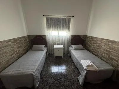 Cama o camas de una habitación en Vivienda Vacacional Casa Aguatona