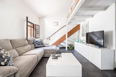 Una televisión o centro de entretenimiento en Boho BungalowPoolPrivate TerraceMaspalomas